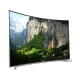Arçelik A65C 9583 5S Ultra HD 4K LED televizyon, kavisli ekranında dağ ve şelale manzarası gösteriyor