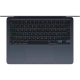 Apple MacBook Air M3 13.6 inç laptop, koyu mavi renkte, üstten açık açıyla klavye ve geniş trackpad görünümü