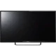 Sunny 55 inç LED siyah Full HD televizyon, ince çerçeveli ekranı ve stand ayağıyla önden görünüm