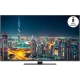 Grundig 49 VLX 9750 SP Ultra HD 4K LED televizyon, gece şehir manzarası ve akıllı kumanda simgesiyle gösteriliyor