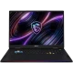 MSI Raider 18 Max HX A2WJ-1059TR siyah oyuncu laptop; RGB aydınlatmalı klavye ve renkli ekran arka planı.