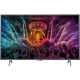 Philips 55PUS6401 Ultra HD 4K LED televizyon; canlı renkli sahne ekranıyla mağaza vitrin görünümü.
