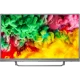 Philips 49PUS6803 Ultra HD 4K LED televizyon; canlı renklerde çiçek manzaralı ekran, genel siyah tasarım