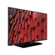 Vestel 40F9510 Full HD LED televizyon, siyah çerçeveli ekranında kırmızı geometrik desenler gösteriyor