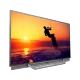 Philips 65PUS8602 Ultra HD 4K LED televizyon, gün batımı sahnesi ve dalga görünümlü ekran, genel renk.