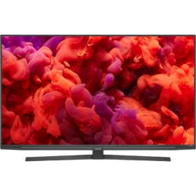 Arçelik A65 A 950 A Ultra HD 4K LED televizyon, kırmızı ve mor tonlarda görüntü sunan ince siyah ekran