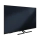 Grundig Monaco 65 GHQ 9550A Ultra HD 4K LED televizyon, siyah ekranı ve ayaklı tasarımıyla önden görünüm