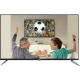 Vestel 55UA9400 Ultra HD 4K LED televizyon, futbol maçı izleyen baba ve oğul sahnesiyle önden görünür.