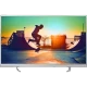 Philips 49PUS7002 Ultra HD 4K LED TV; ekranda gün batımı sahnesi ve skateboard figürü görünüyor