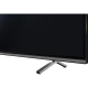 Grundig New York 55 CLX 8670 BP Ultra HD 4K LED televizyonun siyah ekranı ve gümüş ayakları
