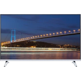 Vestel 55FA9000 Full HD LED televizyon, siyah çerçeveli ekranında gece köprü manzarasıyla
