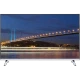 Vestel 55FA9000 Full HD LED televizyon, siyah çerçeveli ekranında gece köprü manzarasıyla