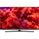 Arçelik A65 A 955 A Ultra HD 4K LED televizyon, siyah çerçeveli geniş ekran ve renkli içerik gösterimi