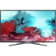 Samsung 49K5579 Full HD LED TV, genel renkli düz ekran üzerinde canlı sualtı sahnesiyle vitrinde