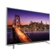 Grundig 65 VLX 7730 SP Ultra HD 4K LED televizyon, köprü ve şehir manzarası gösteren ekran