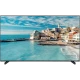 SEG 65SBU740 Ultra HD 4K LED TV, turkuaz deniz ve sahil kasabası manzarasını ekranda gösteriyor
