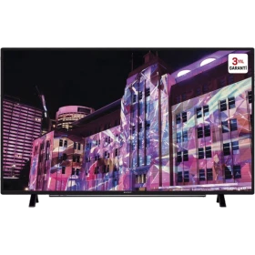 Arçelik A32L 6760 D Full HD LED televizyon, siyah çerçeveli ekranında renkli şehir manzarasıyla