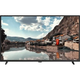Sunny SN43DAL005 Full HD FHD TV, nehir kenarında tarihi evler ve dağlardan oluşan manzarayı gösteriyor