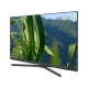 Grundig 55 GEU 9750 A Ultra HD 4K LED televizyon, siyah çerçeveli ekranı ve ayaklı tasarımıyla