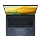 Asus Zenbook 14 UX3402VA-KP659W koyu mavi ultrabook; açık klavye ve dokunmatik panel görünüyor.