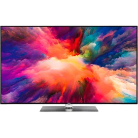Vestel 65UD9650 Ultra HD 4K LED televizyon, renkli ekranı ve gümüş ayaklı tasarımıyla önden görünür