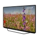 Grundig Belgrad 50 GFU 7905 B Ultra HD 4K LED televizyon, siyah çerçeveli ve çiçekli doğa görüntülü ekranıyla önümde duruyor