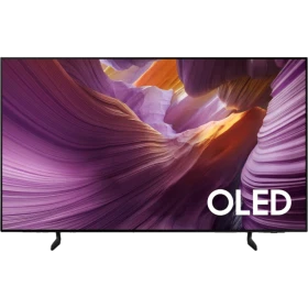 Samsung 83S85F Ultra HD 4K OLED televizyon, vitrin ön ekranında renkli manzara ve “OLED” yazısı.