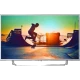 Philips 55PUS6412 Ultra HD 4K LED televizyon; kentsel manzara sahnesi ekranda, siyah çerçeve ve ayaklı tasarım.