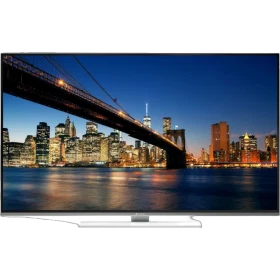 Arçelik A40L 9672 5W Ultra HD 4K LED televizyon, şehir manzarası gösteren siyah ekran ve gümüş ayaklarla aydınlatılmış.