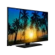 Vestel 32F8500 Full HD LED televizyon, siyah çerçeveli ekranında palmiye ağaçları ve gün batımı gösteriyor.