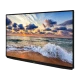 Beko B50K 790G Ultra HD 4K TV, siyah çerçeveli ekranında gün batımında dalgalı denizi gösteriyor