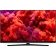 Arçelik A55 A 965 B Ultra HD 4K LED televizyon, kırmızı ve mor ekranıyla önden görünüm