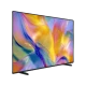 Samsung 100M90H Ultra HD 4K TV, ince siyah çerçeveli ekranında renkli soyut görüntüyle üç çeyrek açıdan görünür.