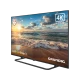Grundig Madrid 55 GJQ 9250 Ultra HD 4K LED televizyon, deniz manzarası gösteren ekranıyla açılı görünümde