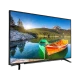 Grundig 32 VLE 6830 BP Full HD LED TV, dağ gölü ve tekneleri gösteren ekranıyla eğimli duruyor