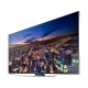 Samsung 85HU7590 Ultra HD 4K TV ekranında şehir ışıkları görünen siyah ve gri televizyon.