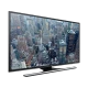 Samsung 40JU6470 Ultra HD 4K TV siyah çerçeveli, şehir manzaralı ekranda canlı görüntü ile gösteriliyor