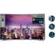 Grundig 55 FLX 9595 SP Ultra HD 4K LED TV, şehir manzarası gösteren geniş ekranlı televizyon.