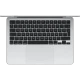 Apple MacBook Air M4 13.6 inç gümüş laptop, üstten görünümde klavye ve geniş trackpad detayıyla
