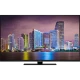 Grundig Miami 49 CLX 9675 BP Ultra HD 4K LED televizyon, şehir manzarası gösteren ekranıyla önden görünüm
