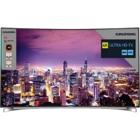 Grundig 65 FLX 9595 SP Ultra HD 4K LED televizyon, şehir manzarası gösteren ince çerçeveli ekran.