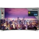 Grundig 65 FLX 9595 SP Ultra HD 4K LED televizyon, şehir manzarası gösteren ince çerçeveli ekran.