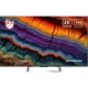 Grundig 55 GQ 800A Ultra HD 4K LED televizyon, renkli kaya desenli ekranı ve siyah ayaklı tasarımıyla