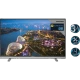 Grundig 48 VLX 8586 BP Ultra HD 4K LED televizyon, şehir manzarası gösteren ekran ve ayaklı tasarım