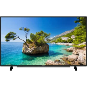 Grundig 32 VLE 5730 BN Full HD LED televizyon, siyah çerçeveli ekranında berrak deniz manzarası gösteriyor.