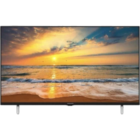 Grundig 43 GHF 6500 B Full HD LED televizyon, siyah çerçeveli ve ayaklı tasarım, plaj manzaralı ekran.