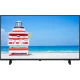 Arçelik A40 B 550 B Full HD LED televizyon, plaj ve deniz manzarası görüntülerken önden görünür