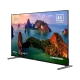 Grundig 65 GKU 750 Ultra HD 4K LED TV, manzara görüntüsü ve gümüş ayaklarıyla önden görünüm